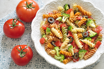 Tomato Pasta Salad in a white bowl