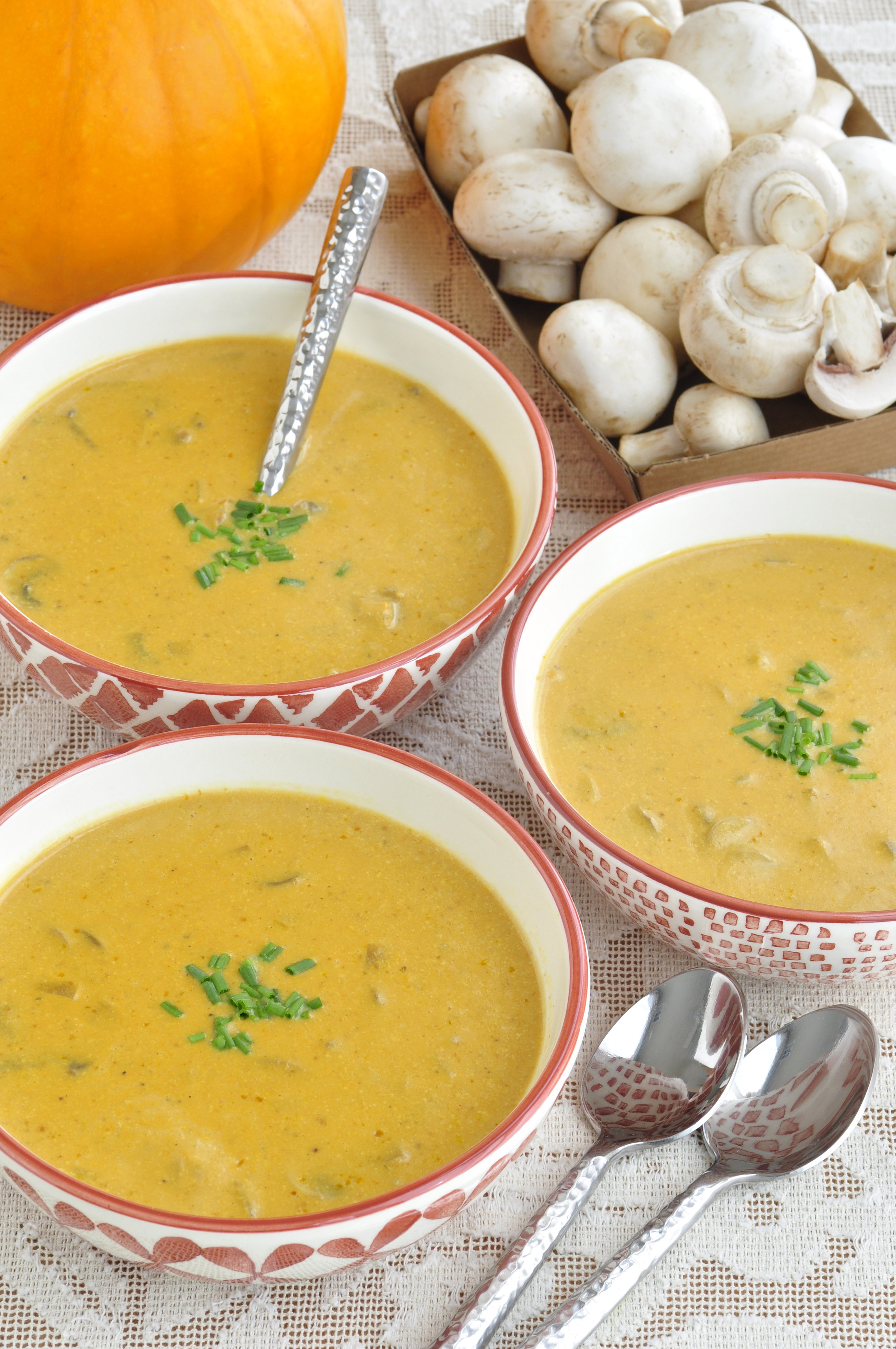 Curried Pumpkin Soup served in bowls on table