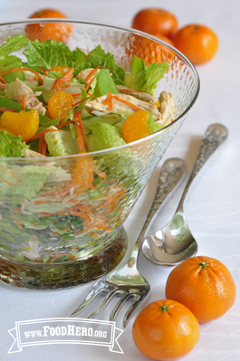 Large bowl of mandarin orange and chicken salad. 