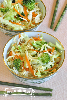 Cabbage and vegetable mix on a bed of ramen noodles.