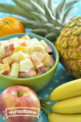 Small bowl of cubed fruit with a yogurt dressing.