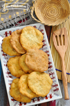 Platter of stacked golden fry bread.