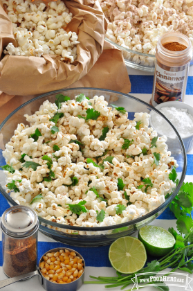 Large bowl of seasoned popcorn with cilantro.