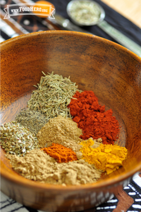 Wooden bowl with ground spices.