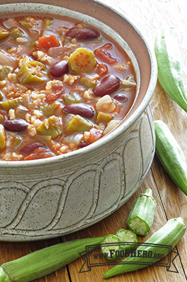 Bowl of okra, rice and bean soup with tomato-based broth.