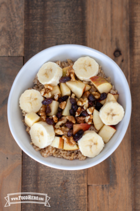 Rice and fruit topped with chopped nuts.