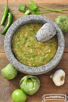 Bowl of green textured salsa. 