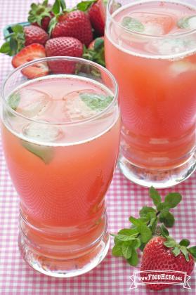 Glasses of pink strawberry water with mint.