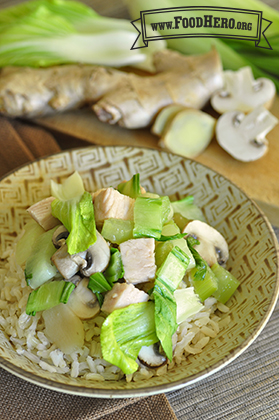 Plate of rice with a turkey and vegetable topping.