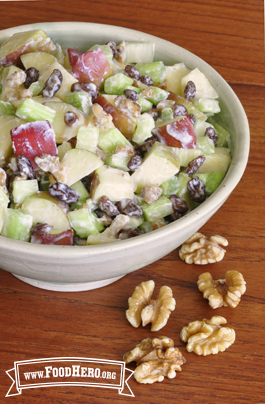 Bowl of creamy apple, celery and walnut mix.