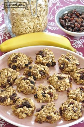 Chewy oat and raisin cookies are shown on a serving plate.