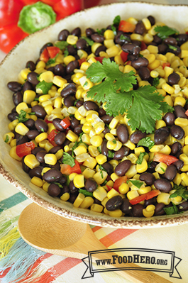 Appetizing variety of corn, bean and vegetable mix garnished with cilantro