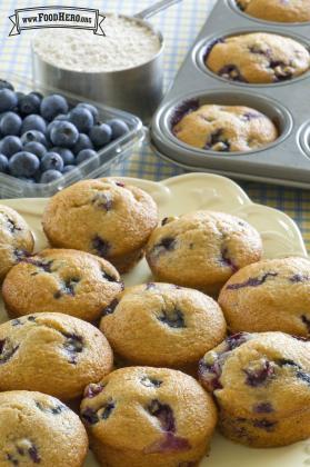 Plate of fluffy blueberry muffins.