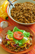 Bowl of chorizo shown served with a fresh salad.