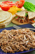 Plate of tender shredded pork. 