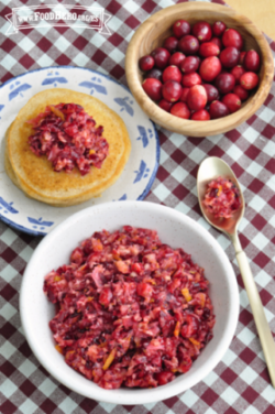 Bowl of cranberry relish served with a pancake.