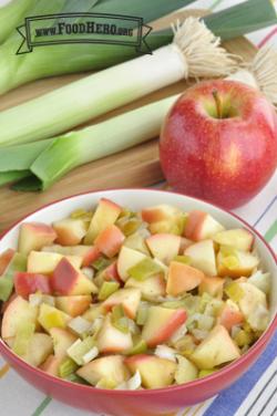  Bowl of tender leeks and red apples.