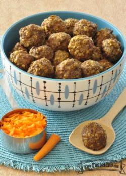 A bowl of baked meatballs made with oatmeal and grated carrot is shown on a placemat.