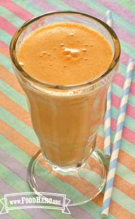 Sundae glass of yogurt and orange juice mix.