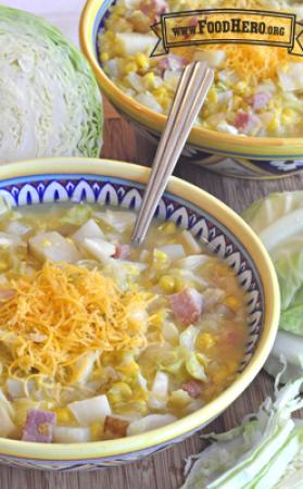 Small bowls of potato and ham soup with shredded cheese.