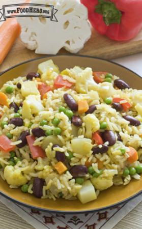 Plate of rice and bean mix with vegetables. 