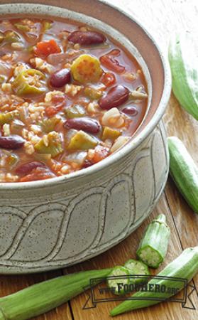 Bowl of okra, rice and bean soup with tomato-based broth.