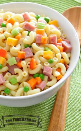 Macaroni noodles with ham, vegetables and dressing.