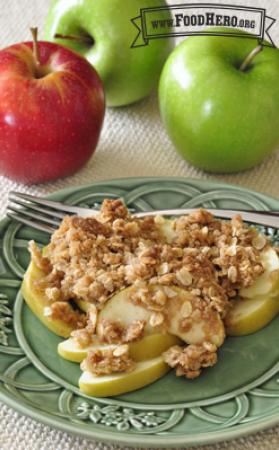 Plate of baked sliced apples with a sweet granola topping.