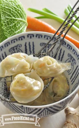 Bowl of wontons with a chicken and vegetable filling.