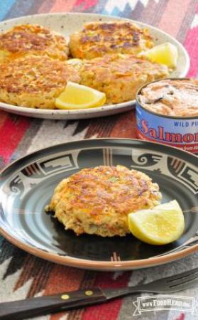 Plate of golden Salmon Patties with lemon slices. 